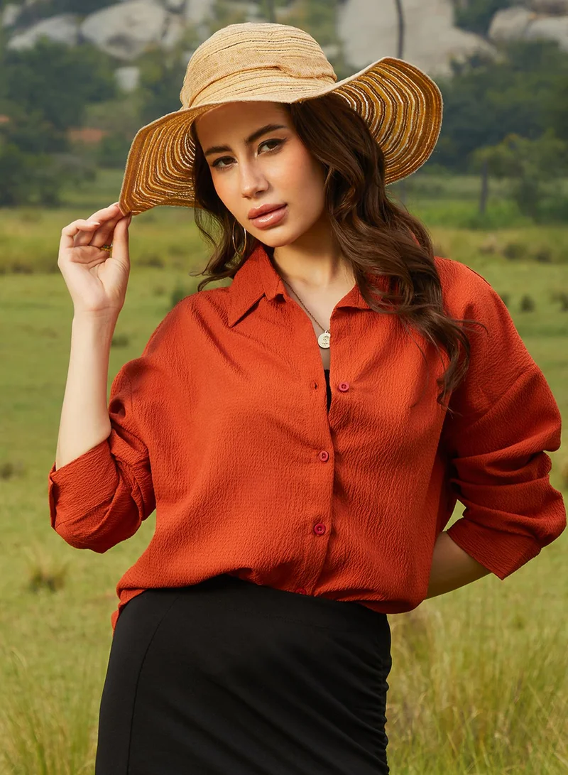 كامبوس سوترا Women's Rust Orange Textured Oversized Shirt For Casual Wear | Spread Collar | Long Sleeve | Button Closure | Oversized Shirt Crafted With Comfort Fit For Everyday Wear
